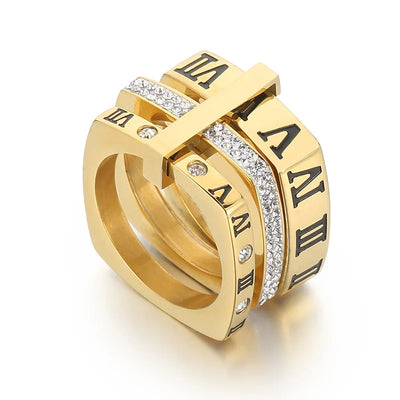Gold rings with Roman numeral design on a white background