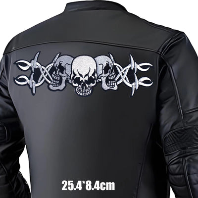 Black leather jacket with skull and crossbar design on the back, size indicated.