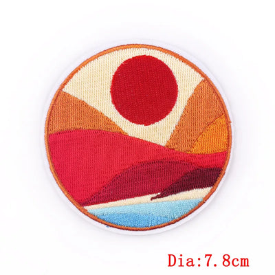 Circular patch with red, orange, and blue design on a white background