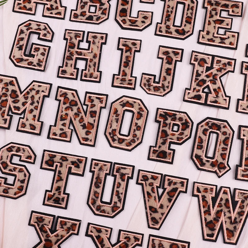 Leopard print letter stickers on a white background