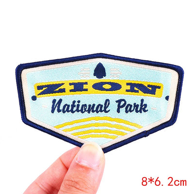 Zion National Park patch held by a hand with size indication