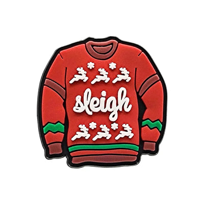 Shoe charm ornament of Red sweater-shaped enamel pin with 'sleigh' text and reindeer design on a white background