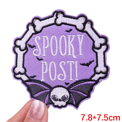 Halloween-themed patch with 'Spooky Post!' text and bones on a purple background.