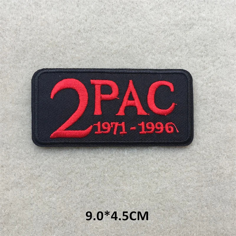 Embroidered patch with '2PAC' and years on a gray background