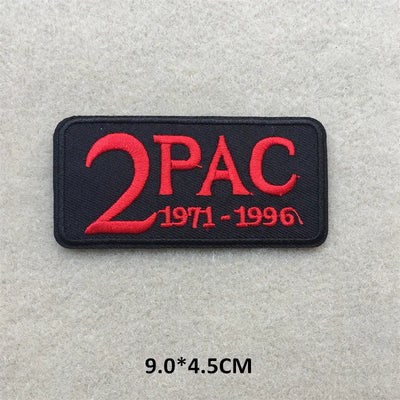 Embroidered patch with '2PAC' and years on a gray background