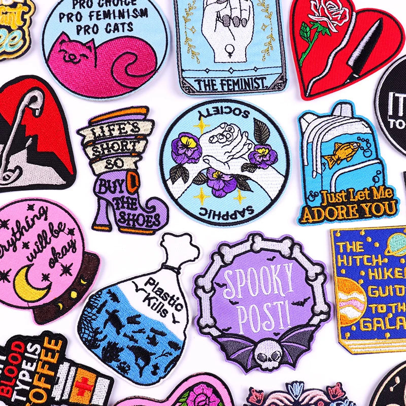 Collection of colorful stickers with various designs and text on a white background