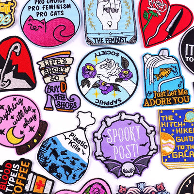 Collection of colorful stickers with various designs and text on a white background