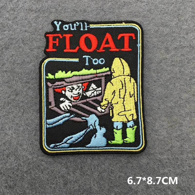 Embroidered patch with a character in a yellow raincoat and text on a gray background