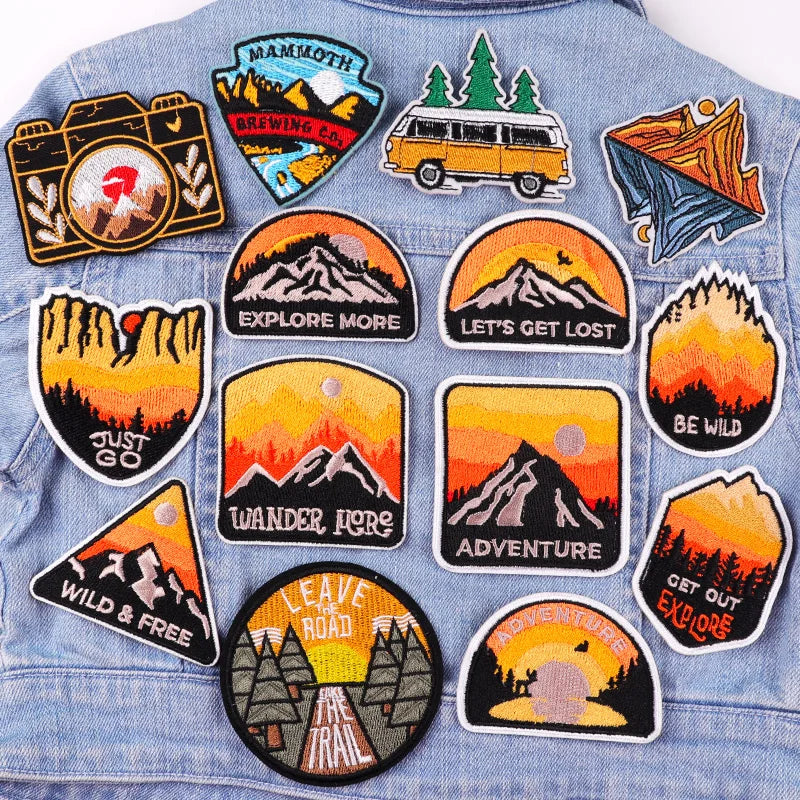 Collection of outdoor-themed patches on a denim jacket
