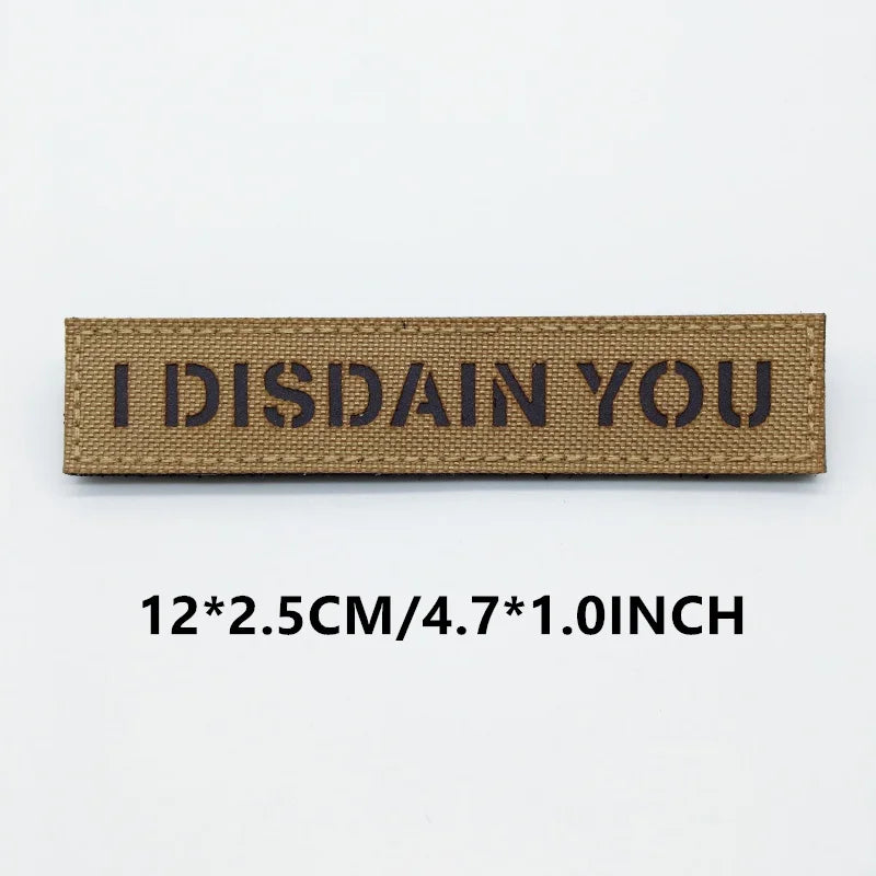 Rectangular patch with 'I DISDAIN YOU' text on a white background
