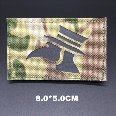 Camouflage patch with a design on a dark background