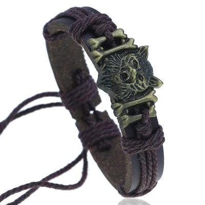 Bracelet with wolf head design and braided leather strap on a white background