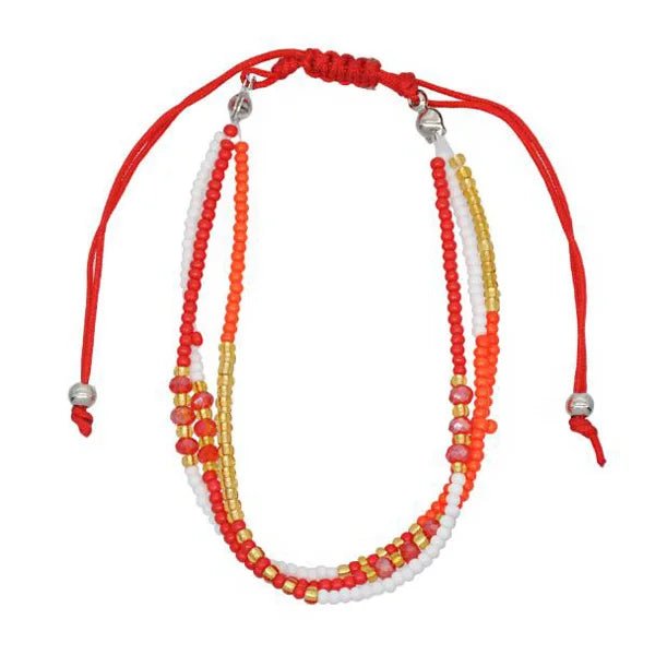 Multistrand beaded necklace with red, orange, yellow, and white beads on a red cord.
