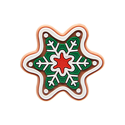 Shoe charm ornament of Decorative star-shaped cookie with green, red, and white icing on a white background