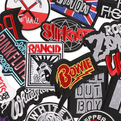 Collection of various band and artist patches including Pink Floyd, Slipknot, Rancid, and Bowie.