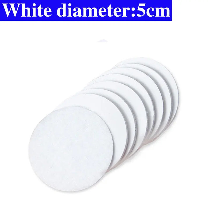 White circular Velcro pads with a diameter of 5cm on a white background