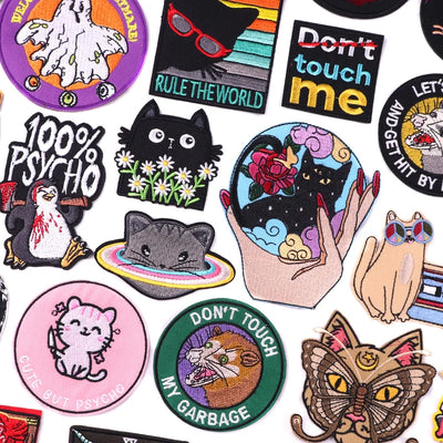 Collection of various colorful patches with different designs on a white background