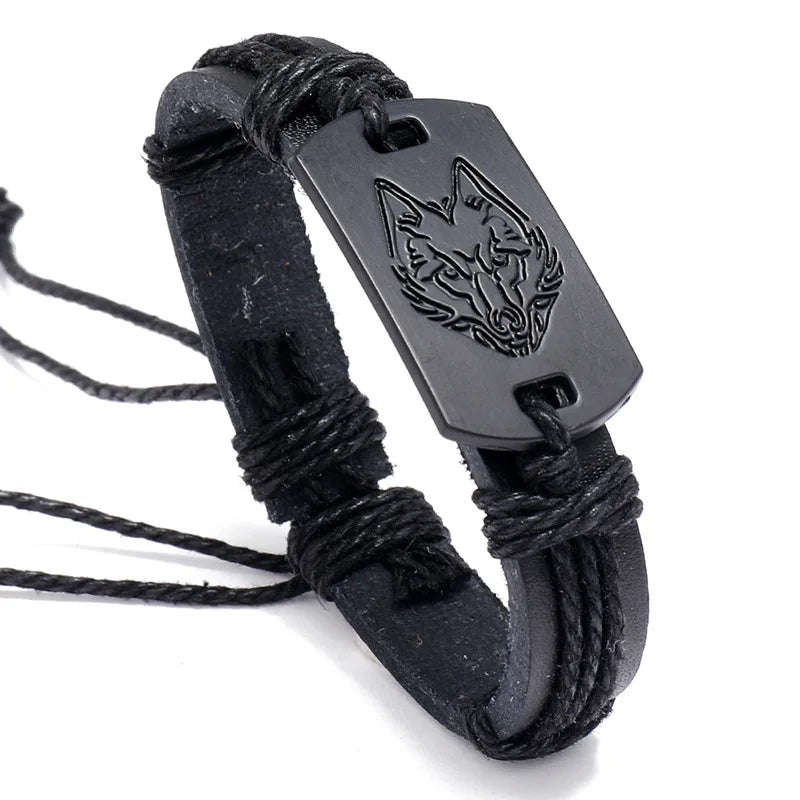 Black leather bracelet with wolf emblem on a white background