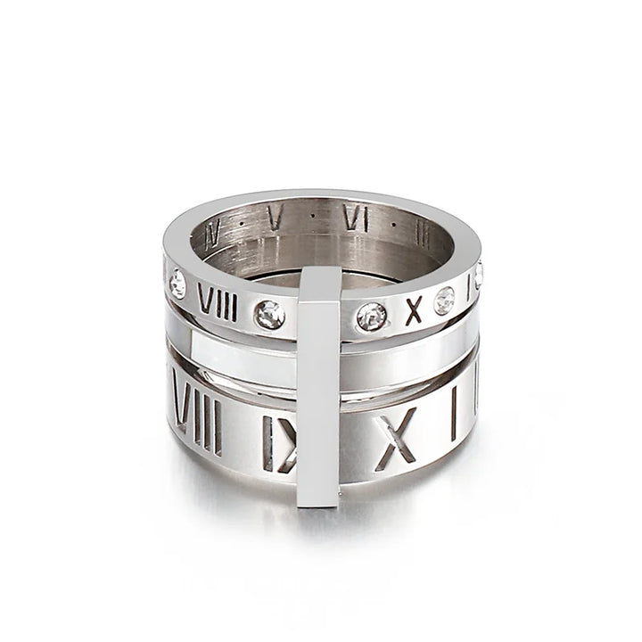 Silver ring with Roman numeral design on a white background