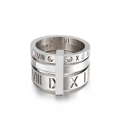 Silver ring with Roman numeral design on a white background
