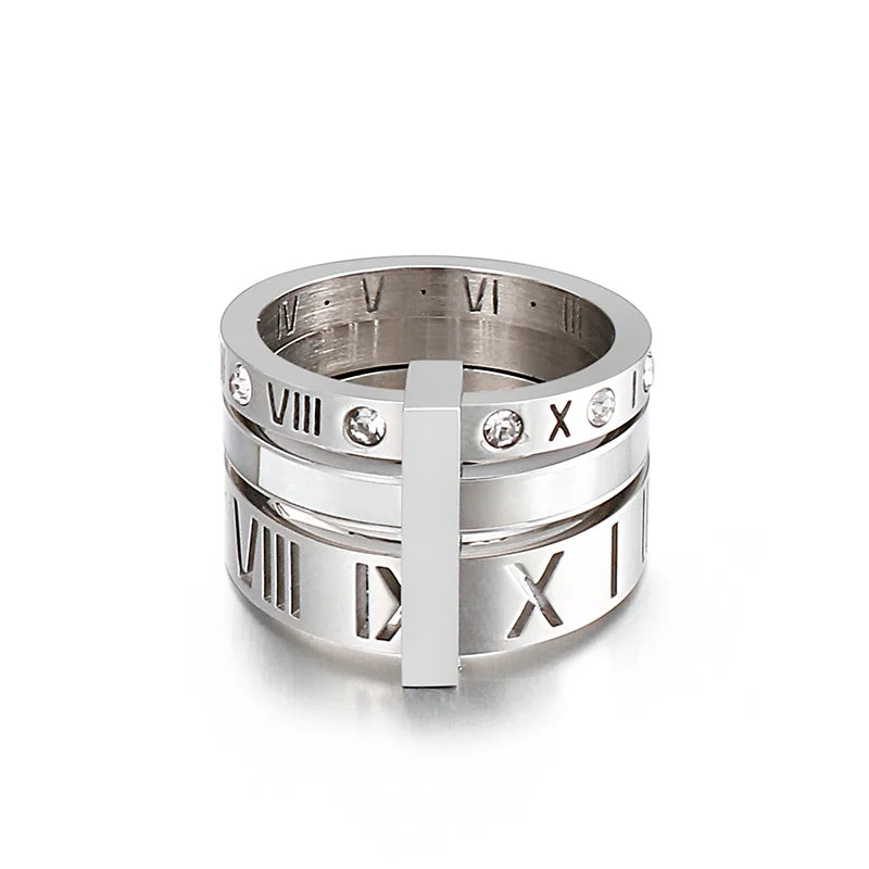 Silver ring with Roman numeral design on a white background