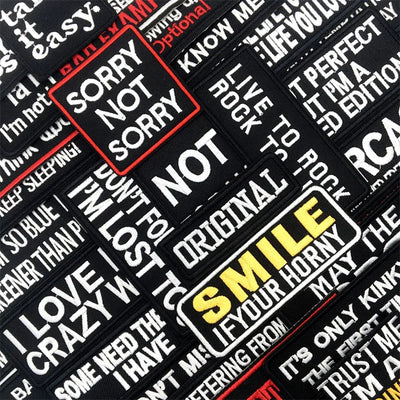 Collection of motivational and humorous stickers with text on a black background