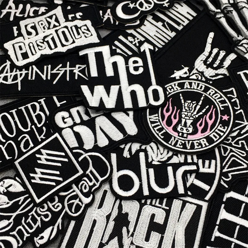 Collection of music-themed stickers with various band names and designs.