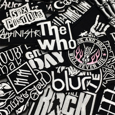 Collection of music-themed stickers with various band names and designs.