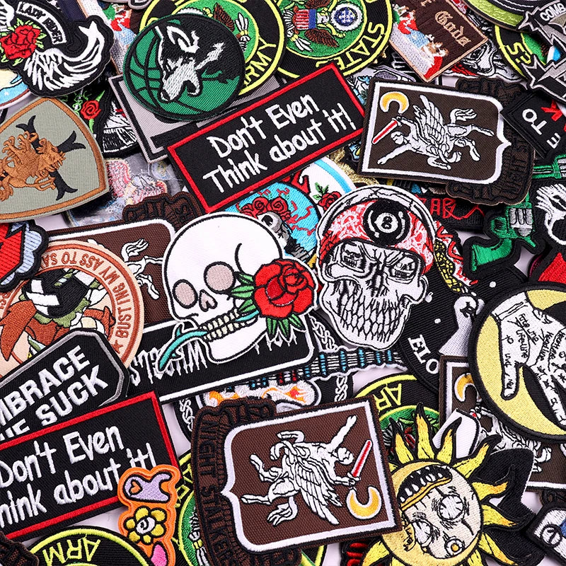 Collection of various colorful patches with different designs and text.