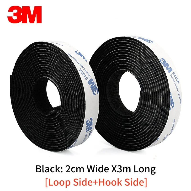 Two rolls of 3M black Velcro tape on a white background 2 cm x 3 meters