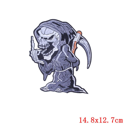 Skeleton with a middle finger and a scythe on a white background, with size 14.8x12.7cm.