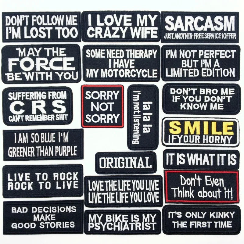 Collection of various text patches with different sayings on a black background