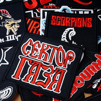 Collection of various patches with different designs and text.