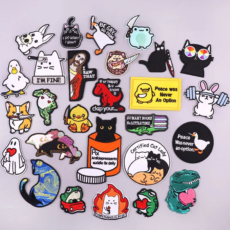 Collection of various colorful pins and stickers on a light gray background