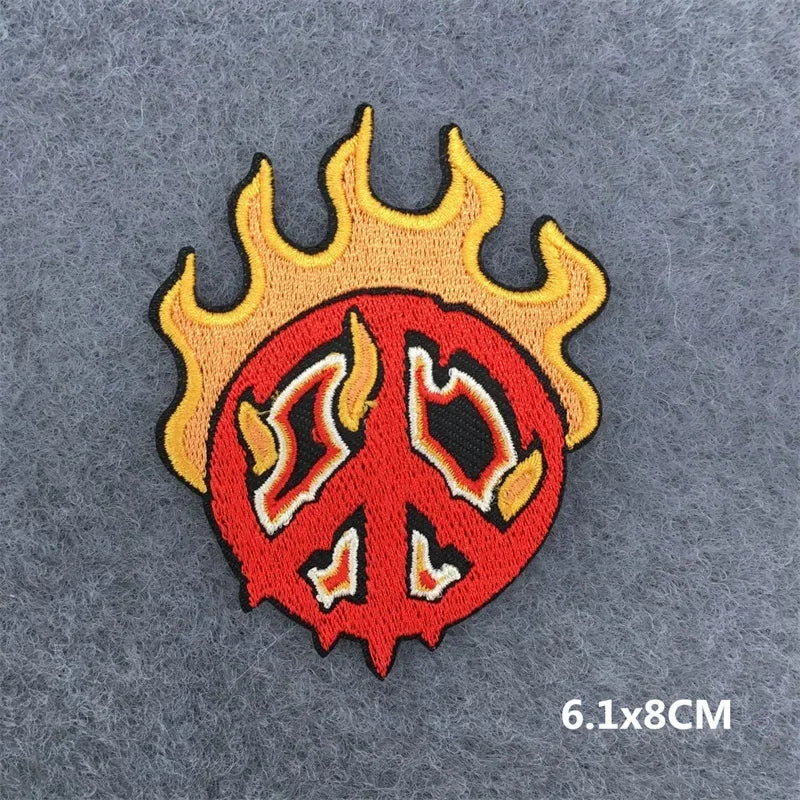Peace symbol with flames on a gray background