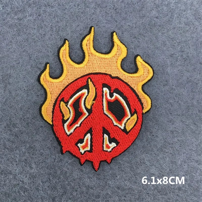 Peace symbol with flames on a gray background