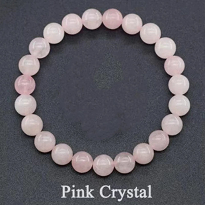 Pink crystal bracelet on a dark gray background