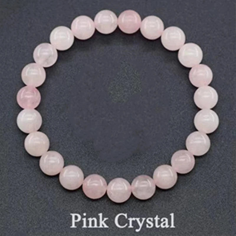 Pink crystal bracelet on a dark gray background
