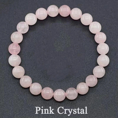 Pink crystal bracelet on a dark gray background