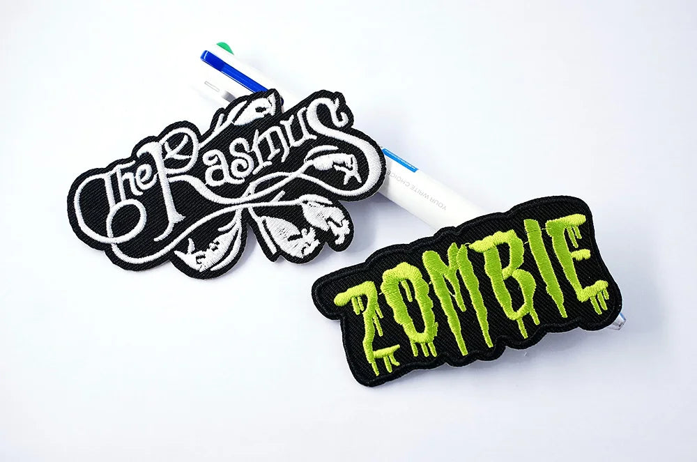 Two patches, one with 'The Last生' text and the other with 'ZOMBIE' text, on a white background.