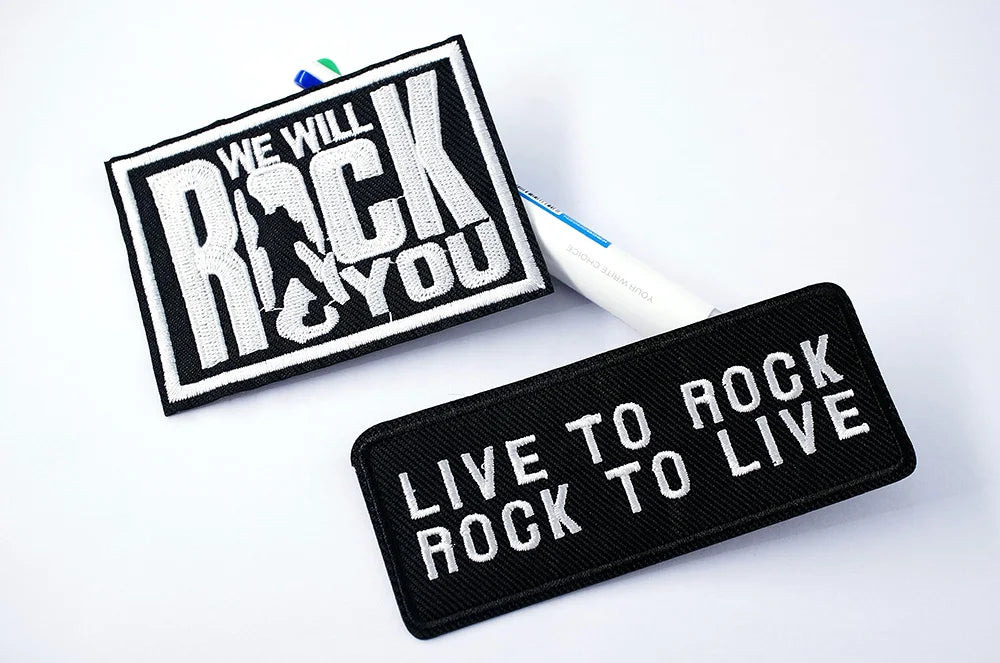 Two patches with motivational phrases on a white background