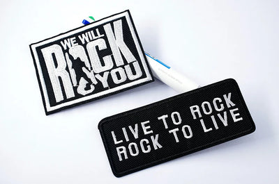 Two patches with motivational phrases on a white background