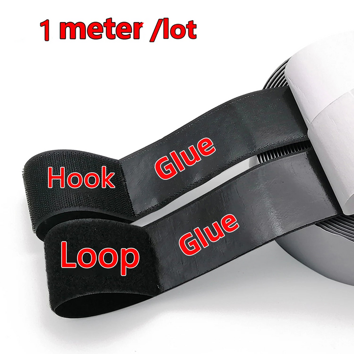 Black hook and loop strap with adhesive on a white background, labeled &