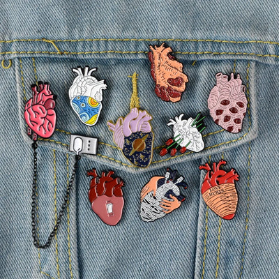 Various heart-shaped pins on a denim jacket