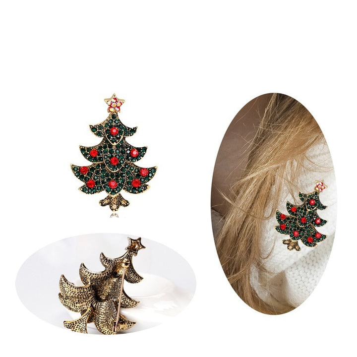 Christmas tree-shaped earrings with red gemstones on a white background.
