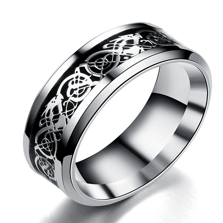 Silver ring with intricate Celtic knot design on a white background