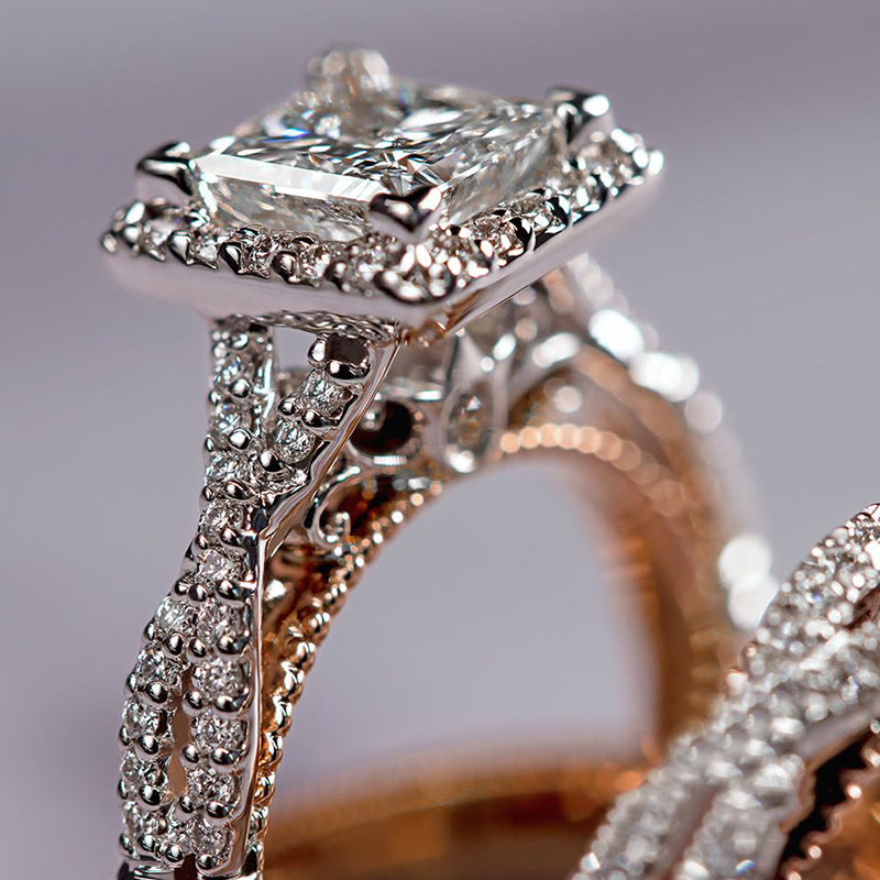 Close-up of a diamond ring with a gray background