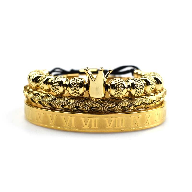 Gold bracelet with Roman numeral design on a white background
