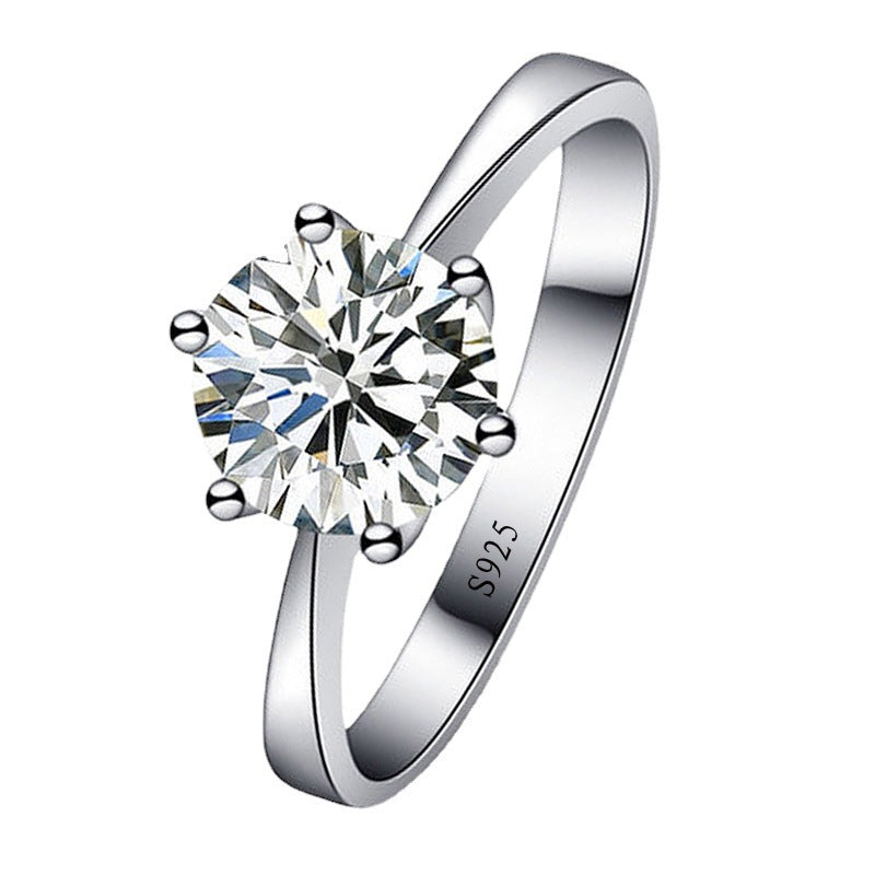 Silver ring with a large diamond on a white background