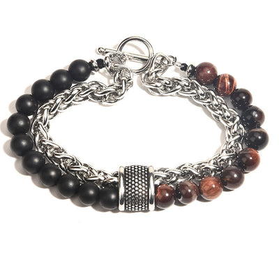 Bracelet with black and brown beads and silver chain on a white background